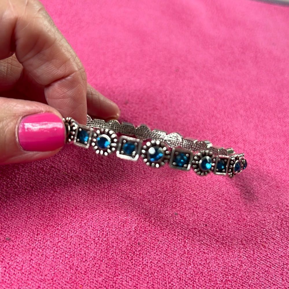 Silver Tone Formed Bracelet With Gorgeous Blue Stones